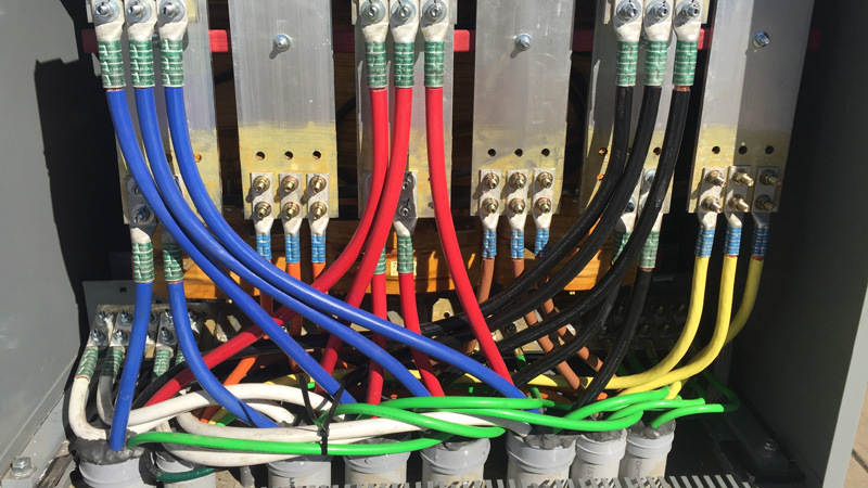 tractor preparing site of large new EV charging center