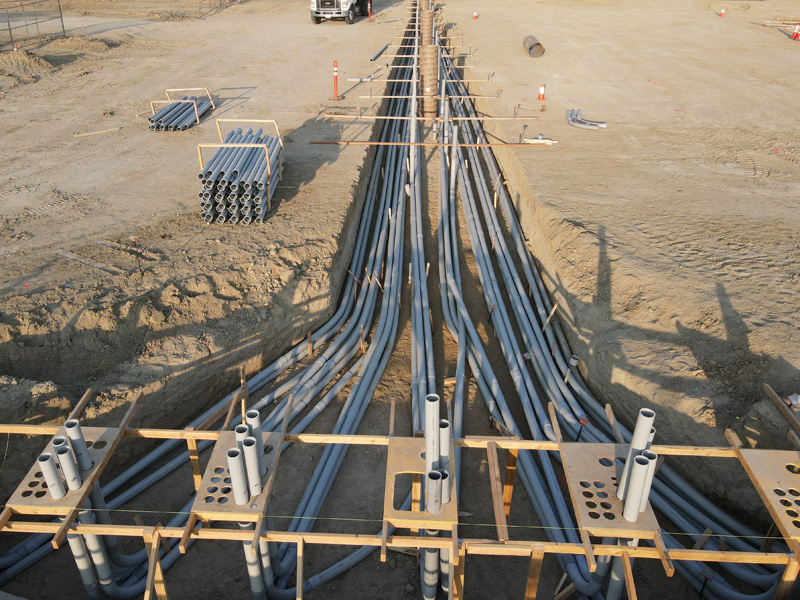 pipe conduit layed in large ditch at construction site
