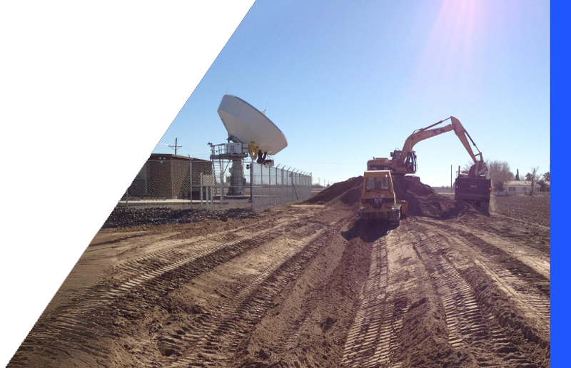 backhoe working at a satellite construction site